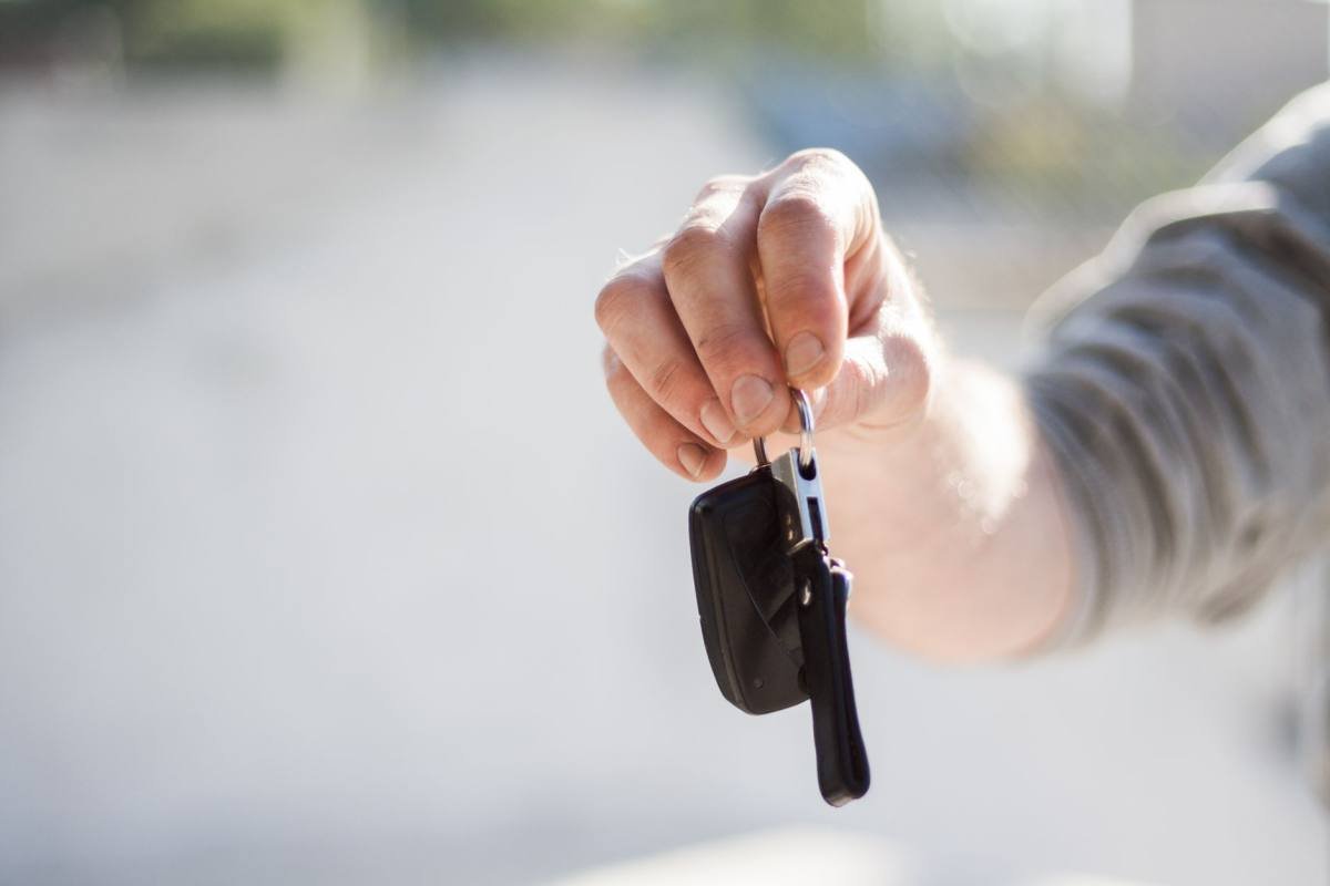 A van driver holding their keys