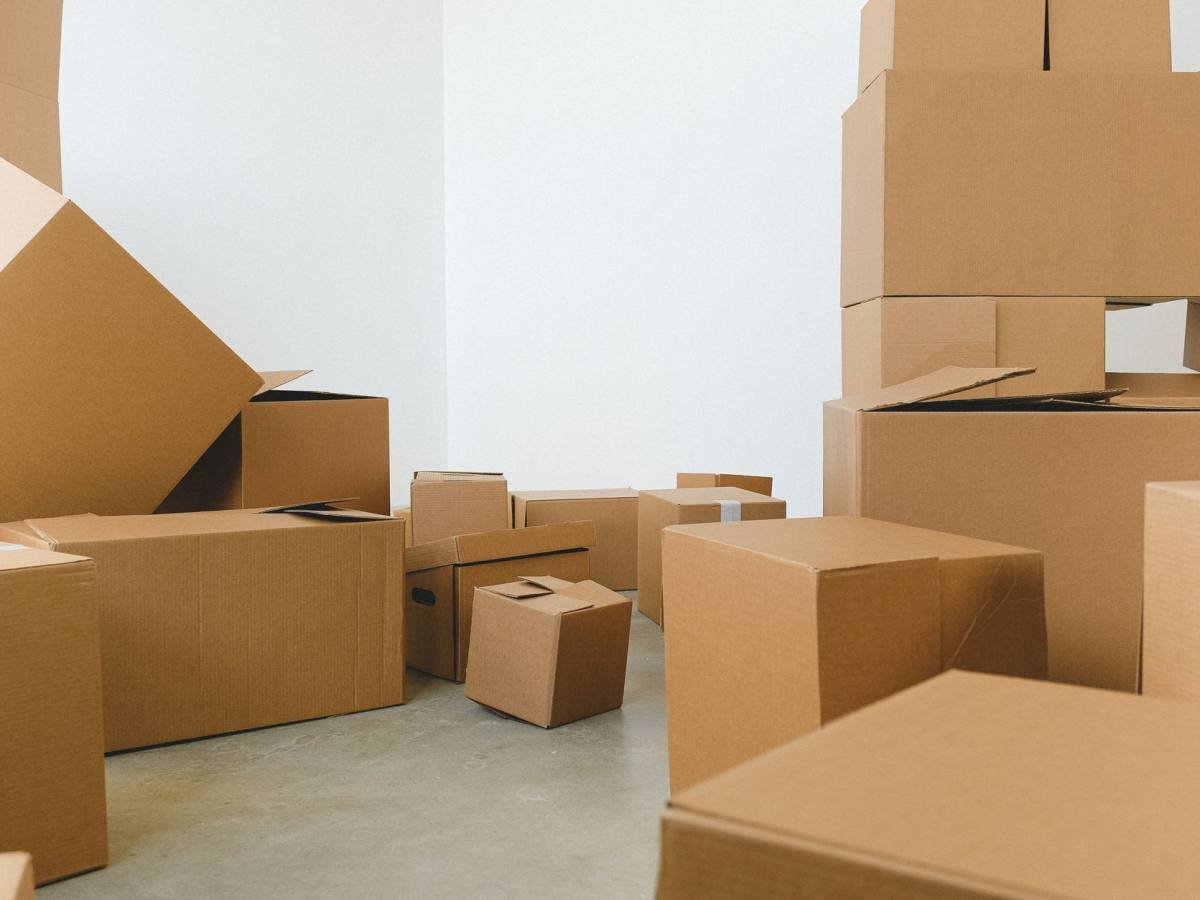 Cardboard boxes stacked in a room ready for a move